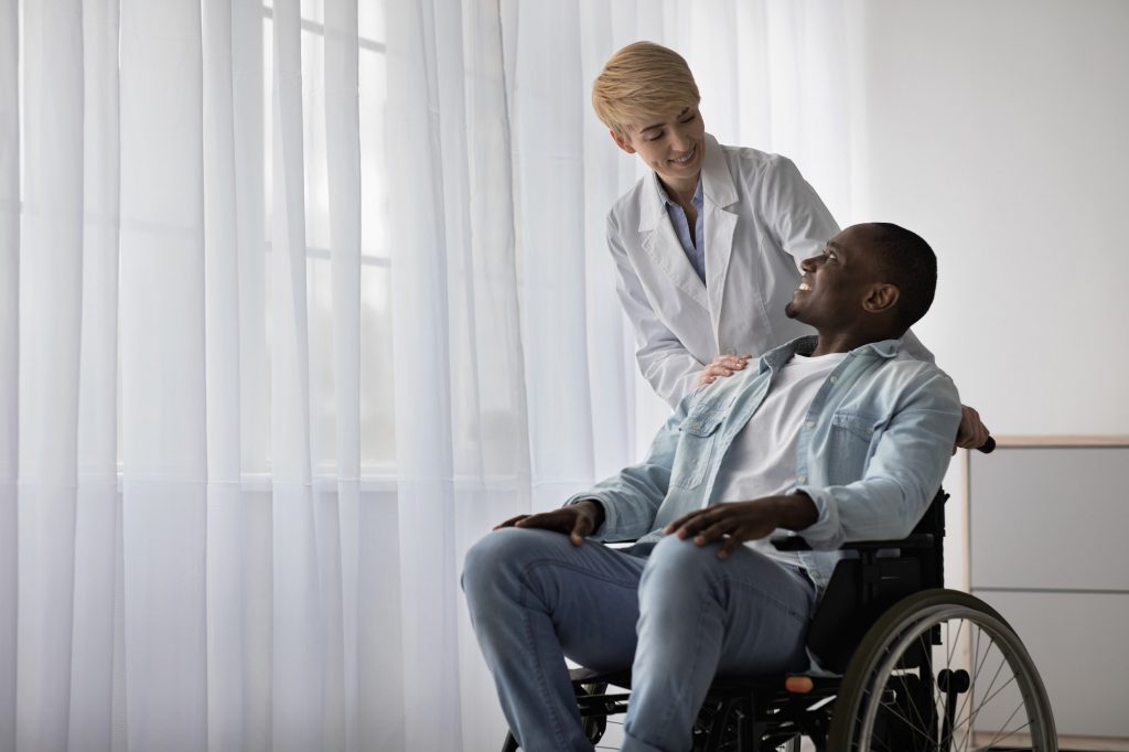 Nurse, doctor and health care, professional helping to person with disabilities